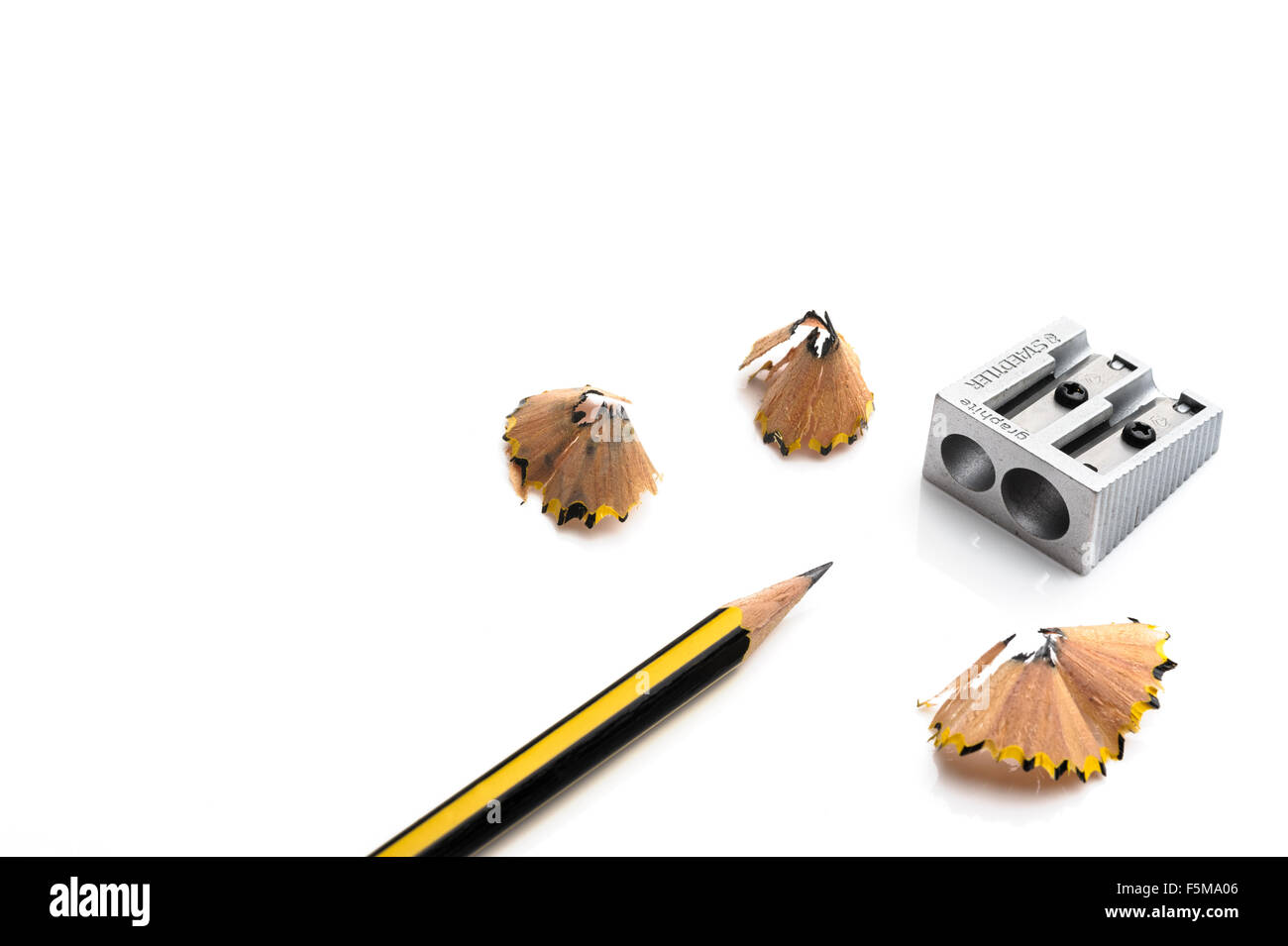 Pencil and metal sharpener Stock Photo