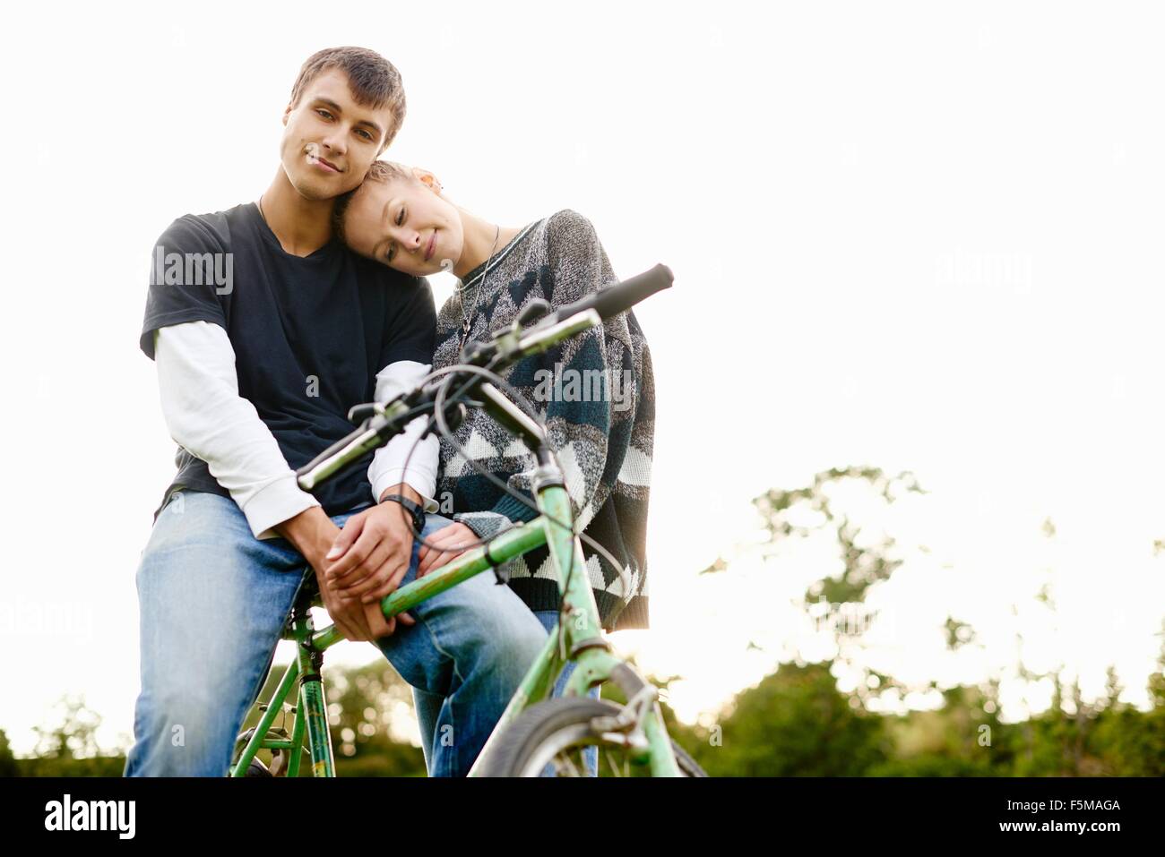 Portrait of romantic young couple with bicycle Stock Photo