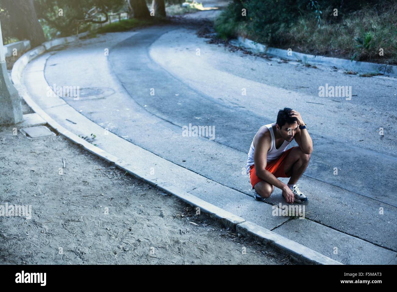 Jogger exhausted, taking break, Arroyo Seco Park, Pasadena, California, USA Stock Photo