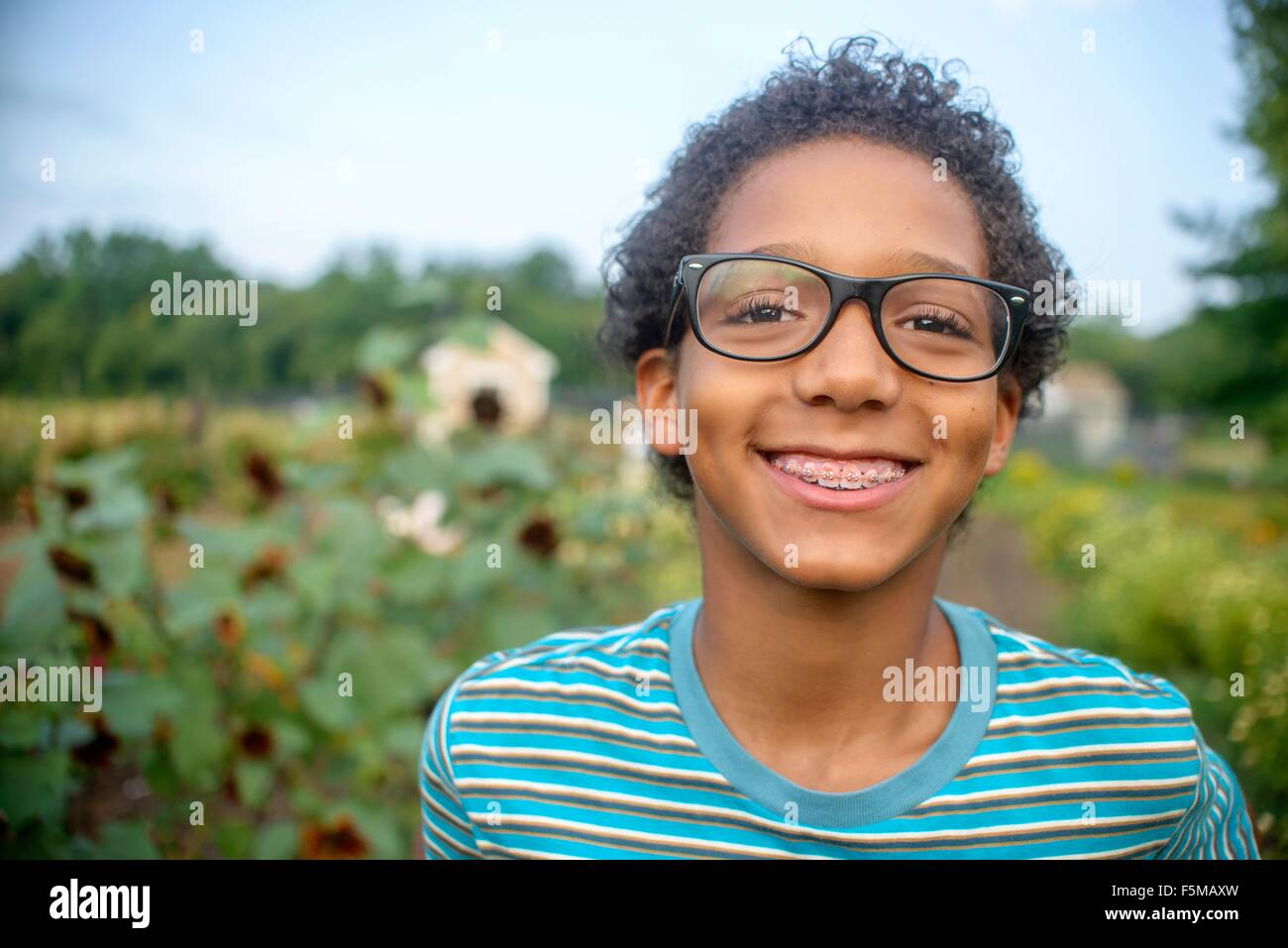 Portrait of boy in farm field Stock Photo