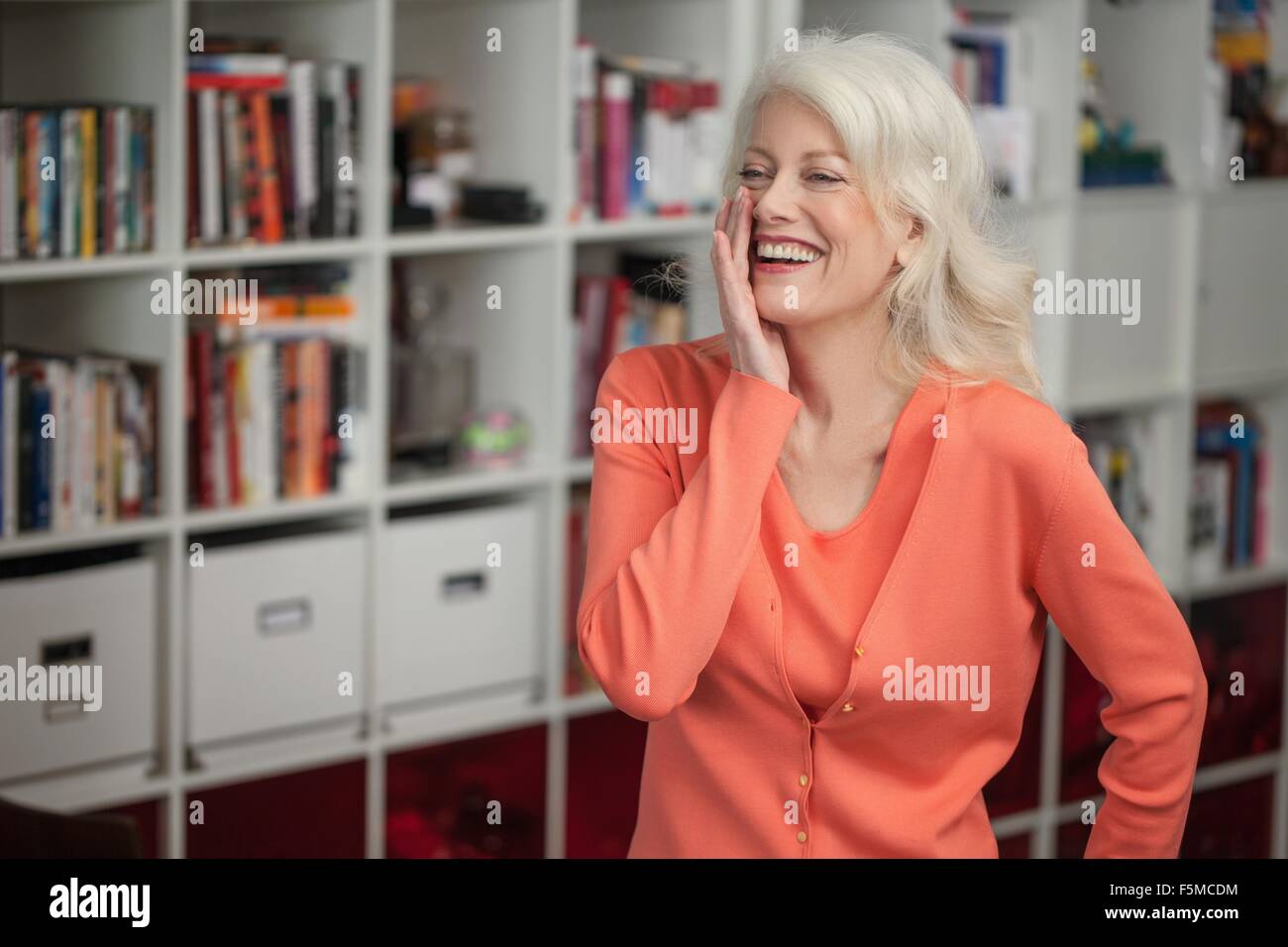 Portrait of mature woman, laughing, indoors Stock Photo