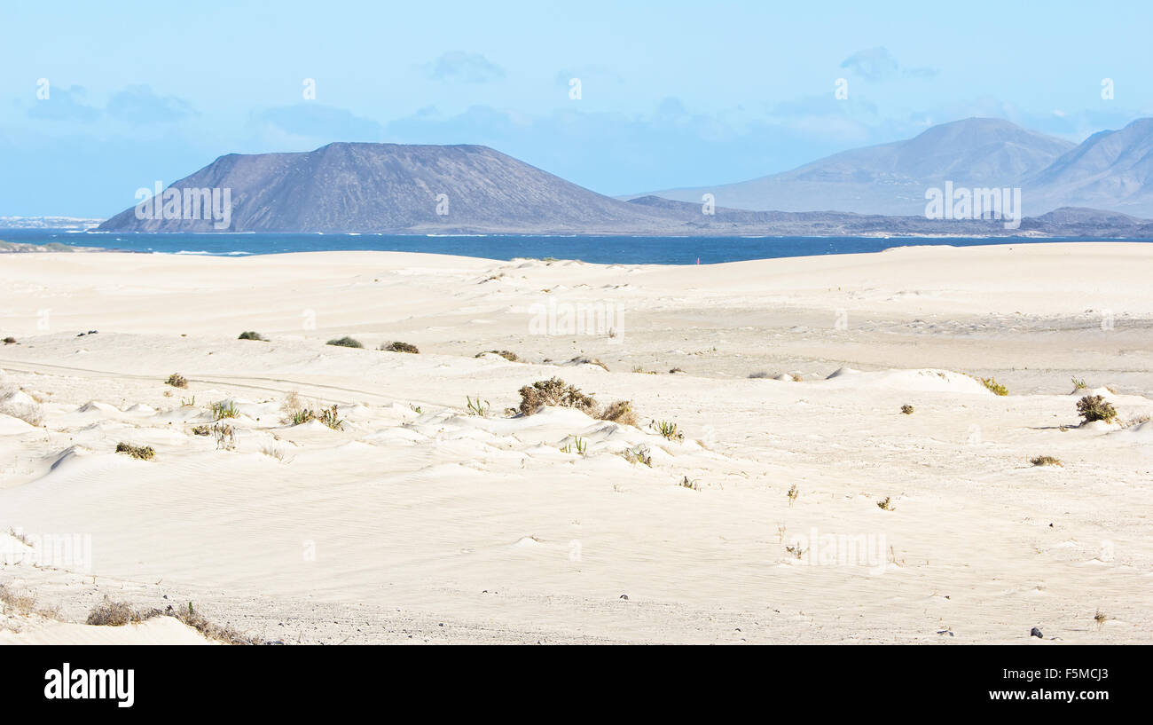 Dunes, Sand, Sea and Volcano in Fuerteventura Stock Photo