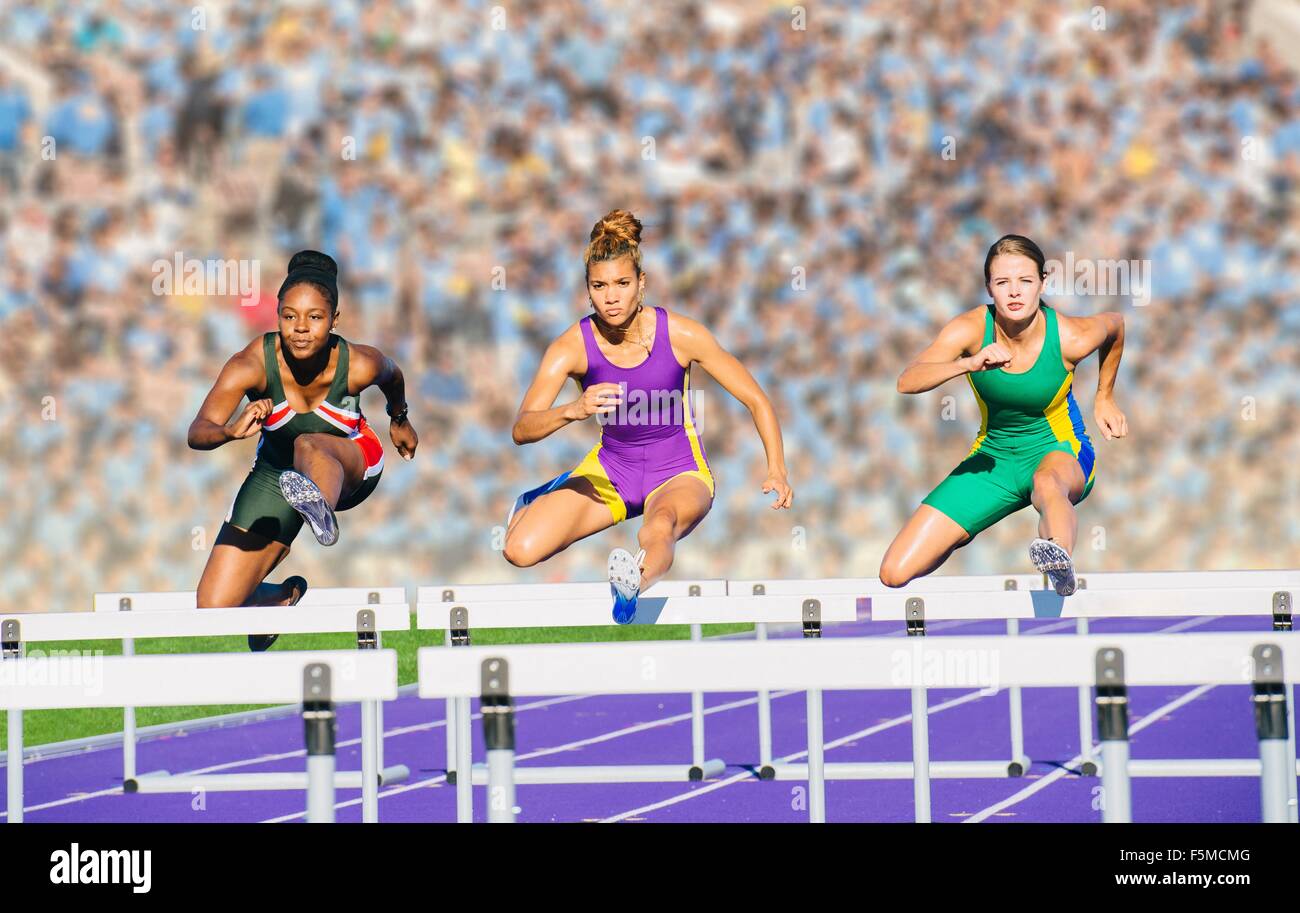 Athlete jumping over hurdle hires stock photography and images Alamy