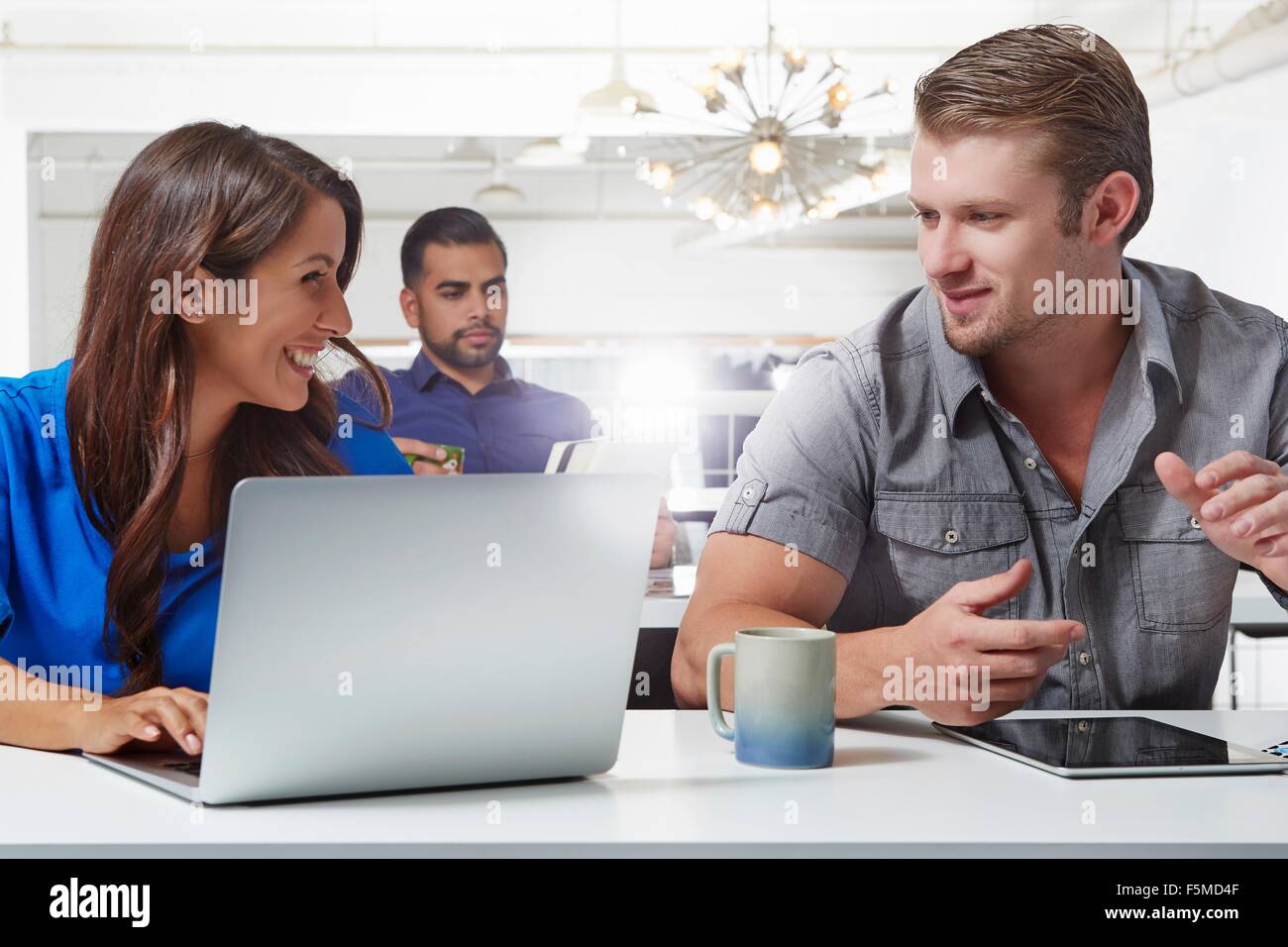Two business colleagues having discussion at desk Stock Photo