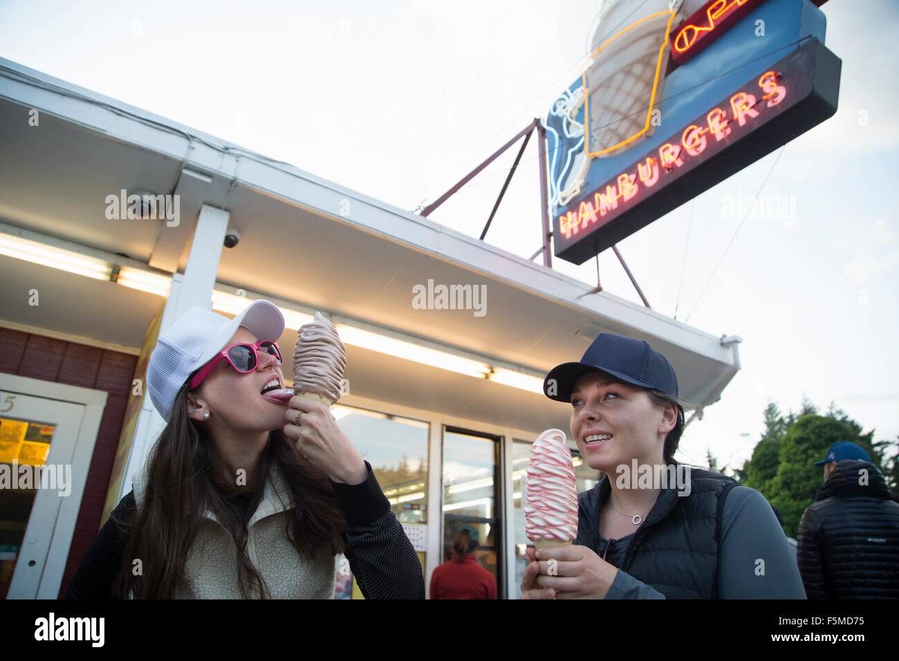 Hikers enjoying ice cream cone at cafe, Lake Blanco, Washington, USA Stock Photo