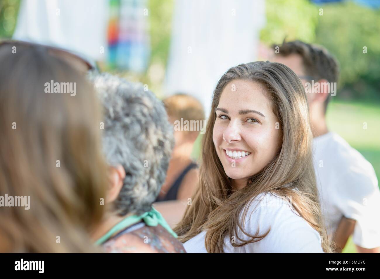 Woman smiling at tomato eating festival Stock Photo