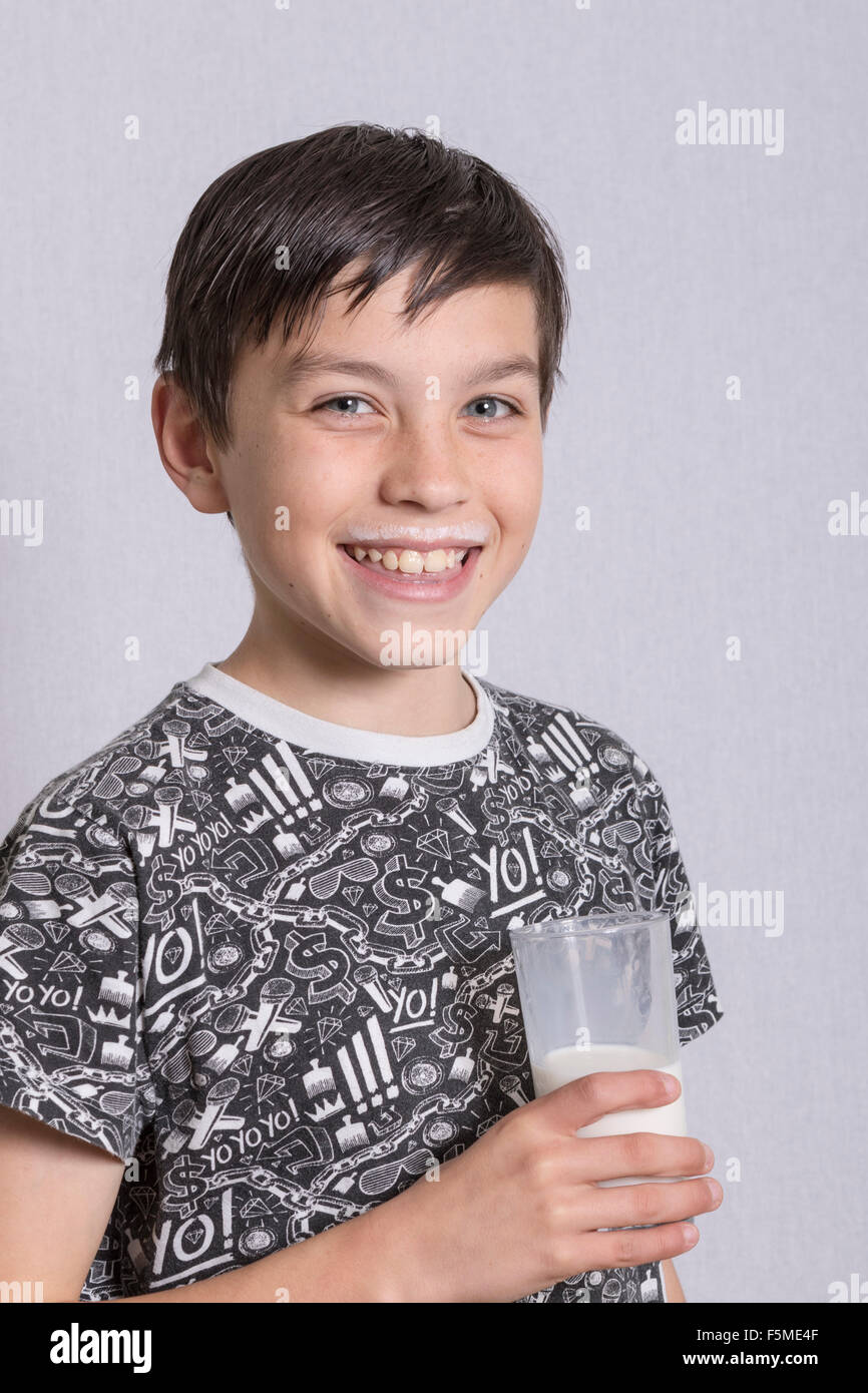 Young boy drinking milk Stock Photo