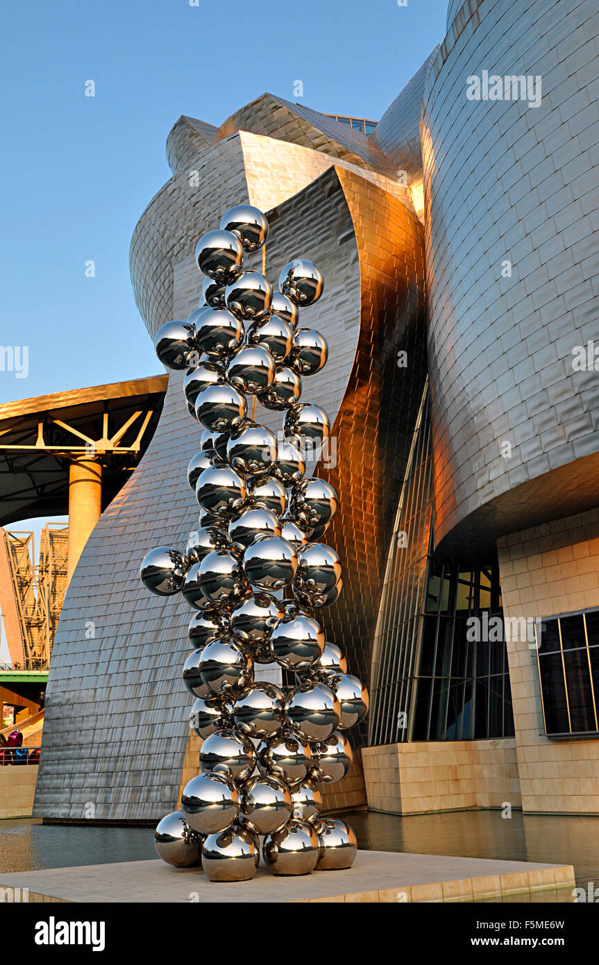 Guggenheim Museum, evening light, architect Frank Gehry, Tall Tree and The Eye by Anish Kapoor, sculptures, Bilbao Stock Photo