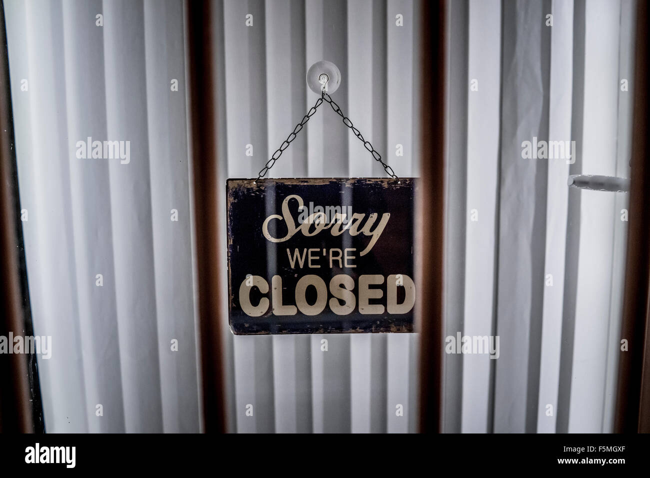 Sorry We're Closed sign hanging on a door Stock Photo
