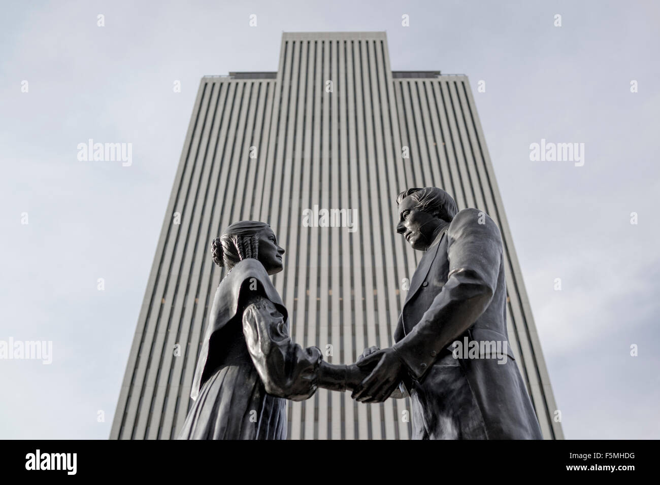 Joseph Smith and his wife Emma standing in front of the Mormons' International Head Quarters, Salt Lake City, Utah Stock Photo