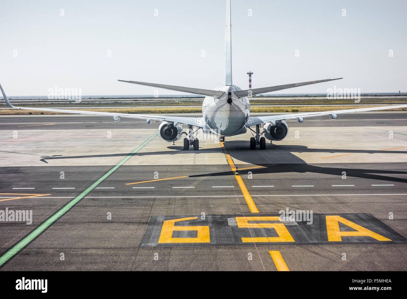 Rear view of a private jet on the runway Stock Photo