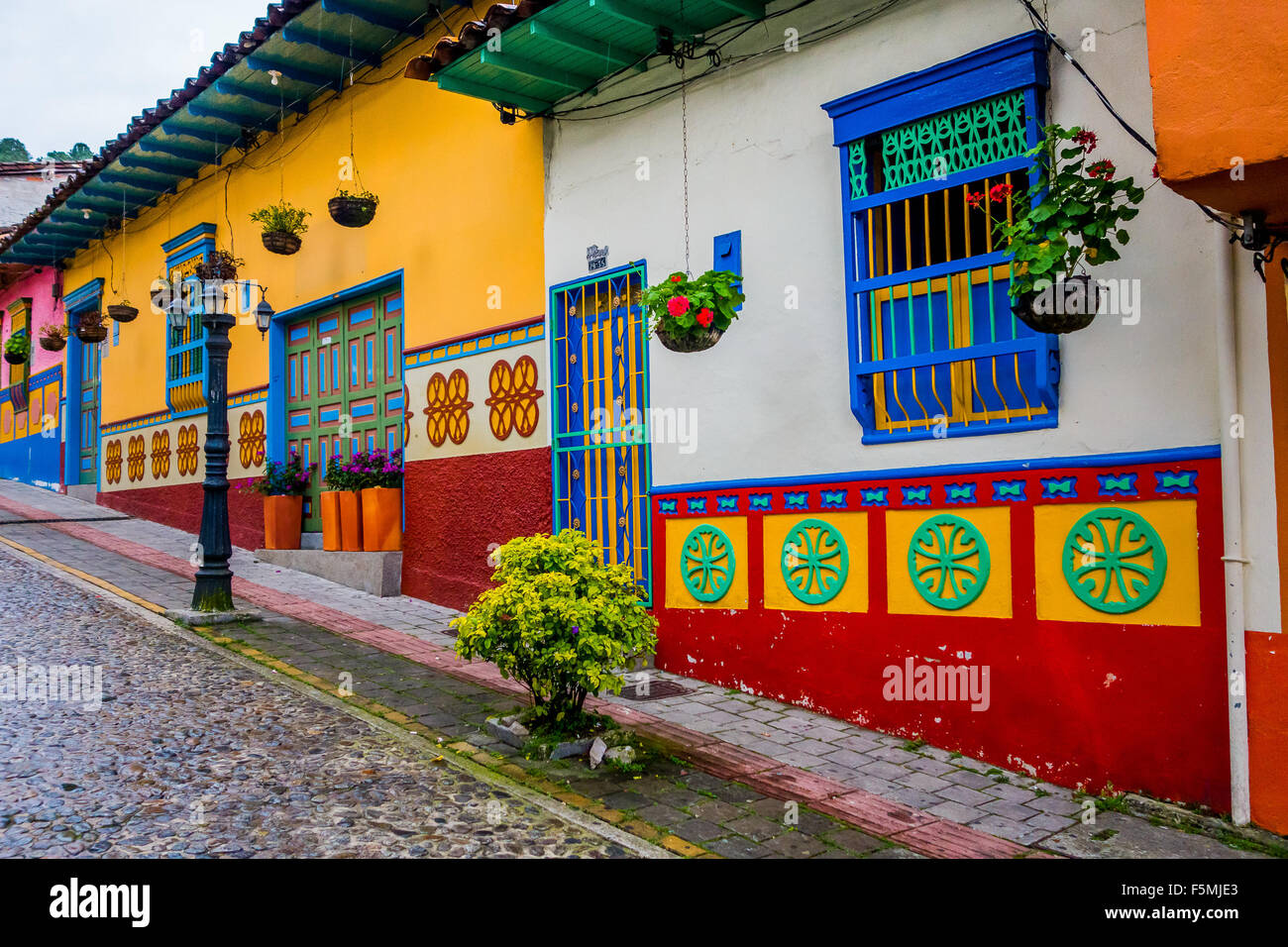 Beautiful and colorful streets in Guatape, known as town of Zocalos ...