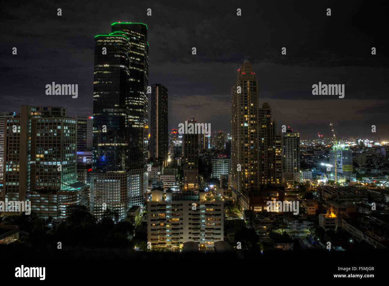 Tall buildings in Bangkok at night Stock Photo - Alamy