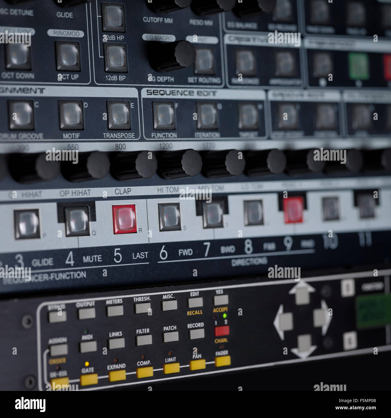 Closeup of rack mounted synthesizers in studio, indoor shot with focus in the center Stock Photo