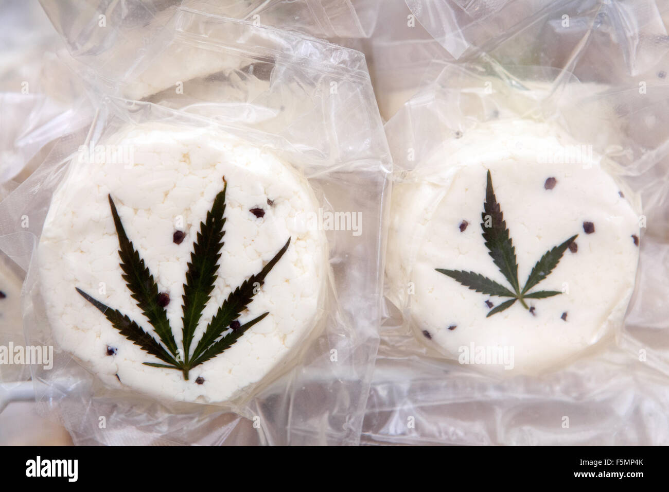 Sheep's cheese vacuum-packed, decorated with a cannabis leaf Prague Czech Republic Family farm product Stock Photo