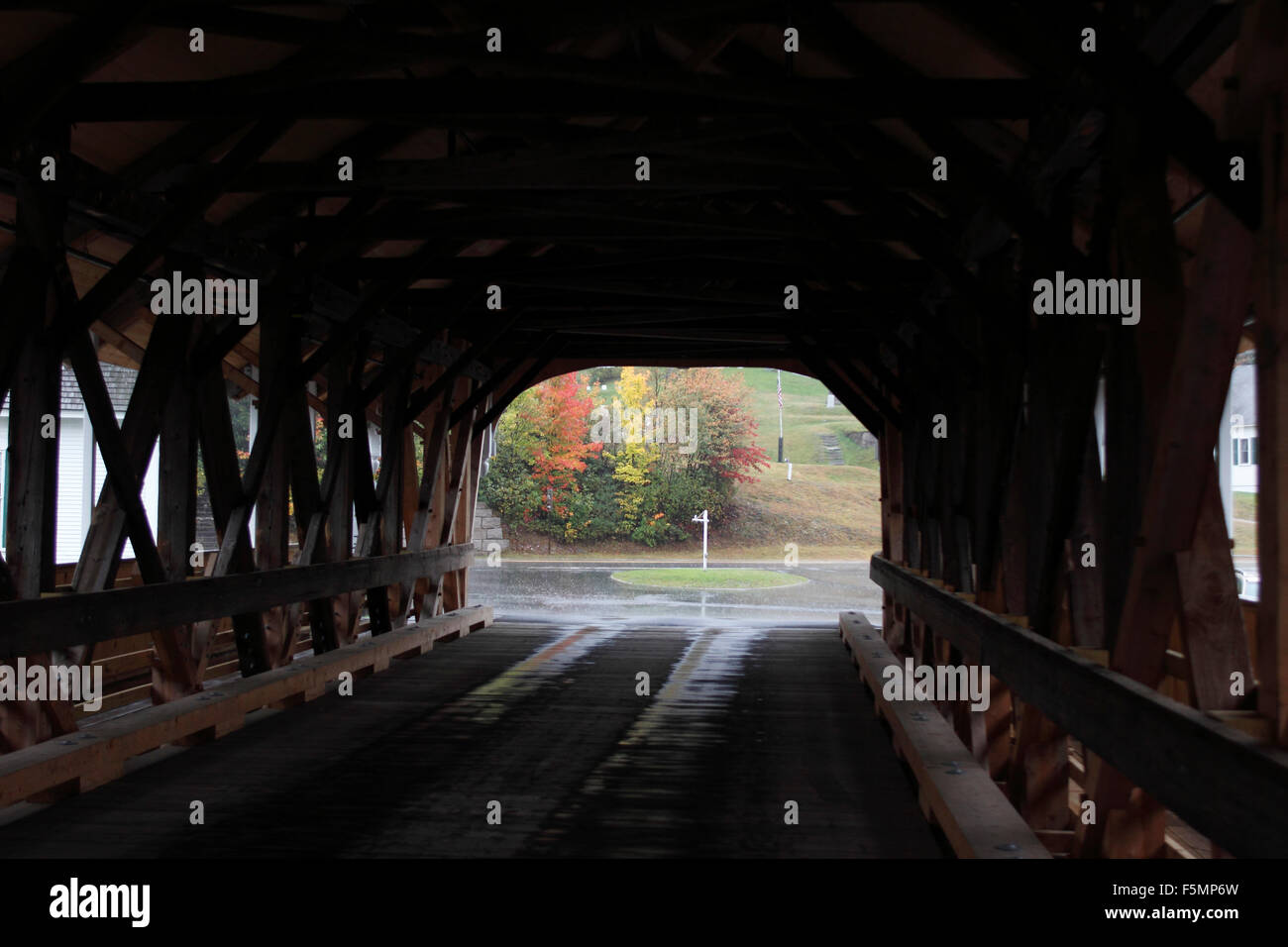 Covered bridge with foliage in rain Stark New Hampshire New England USA