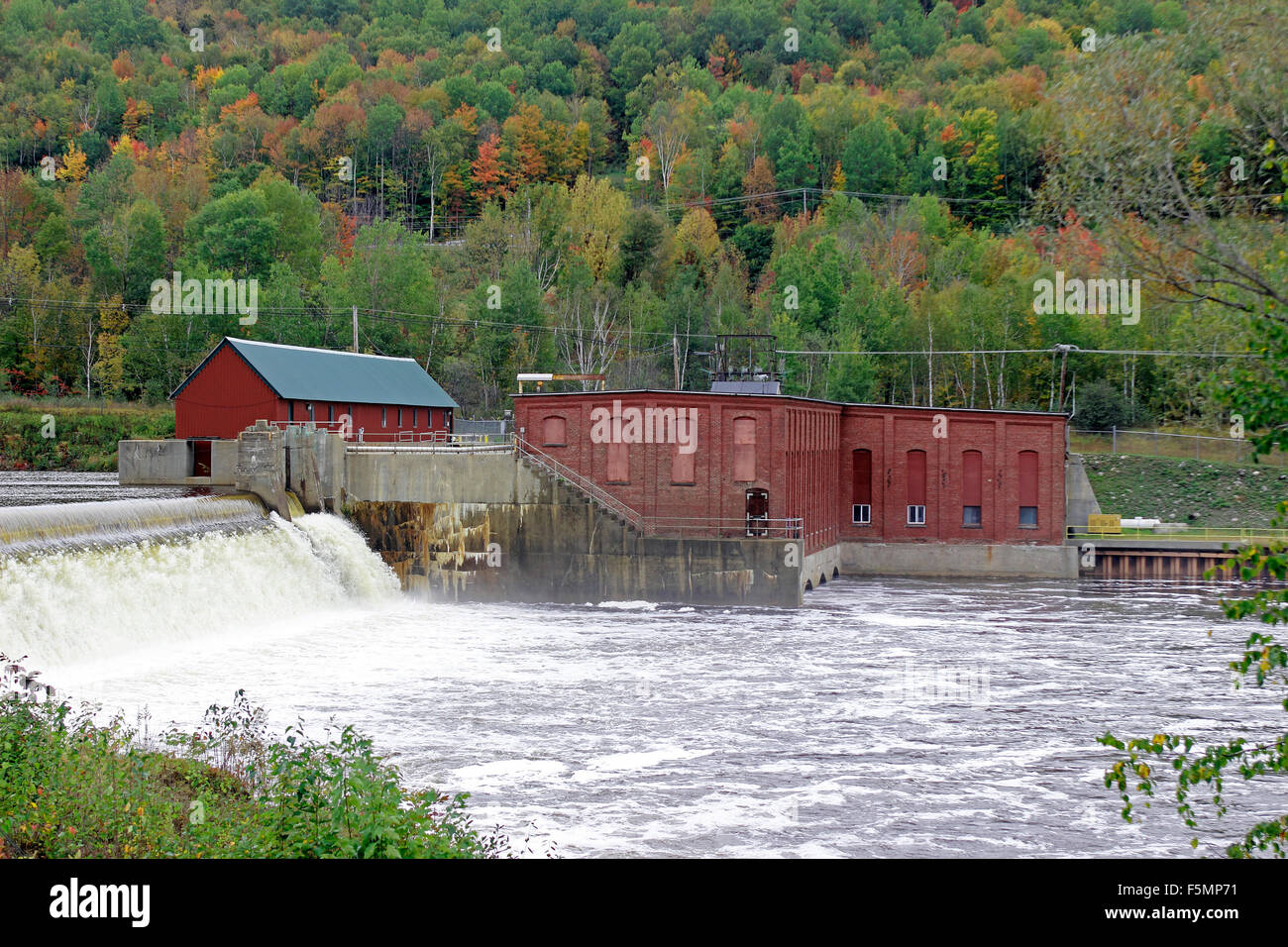 Hydro-power plant fall foliage Androscoggin River Coos County New Hampshire New England USA Stock Photo