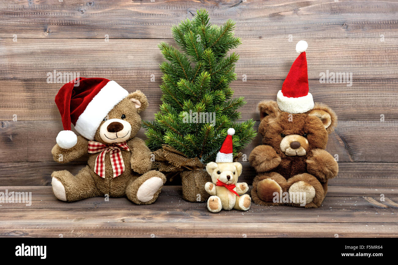 Christmas decoration with nostalgic toys Teddy Bear family. Vintage style toned picture Stock Photo