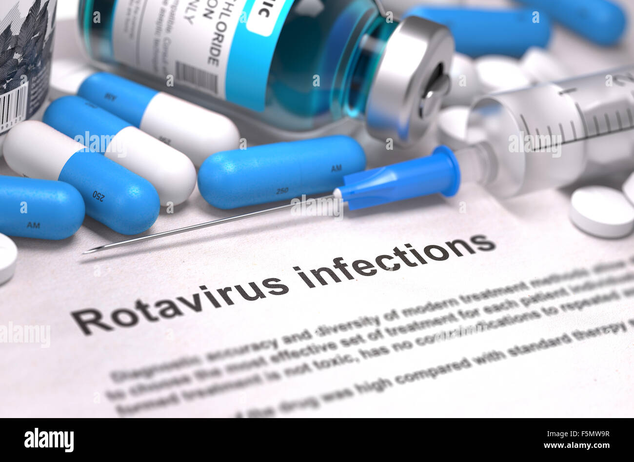 Rotavirus Infections - Printed Diagnosis with Blurred Text. On Background of Medicaments Composition - Blue Pills, Injections an Stock Photo
