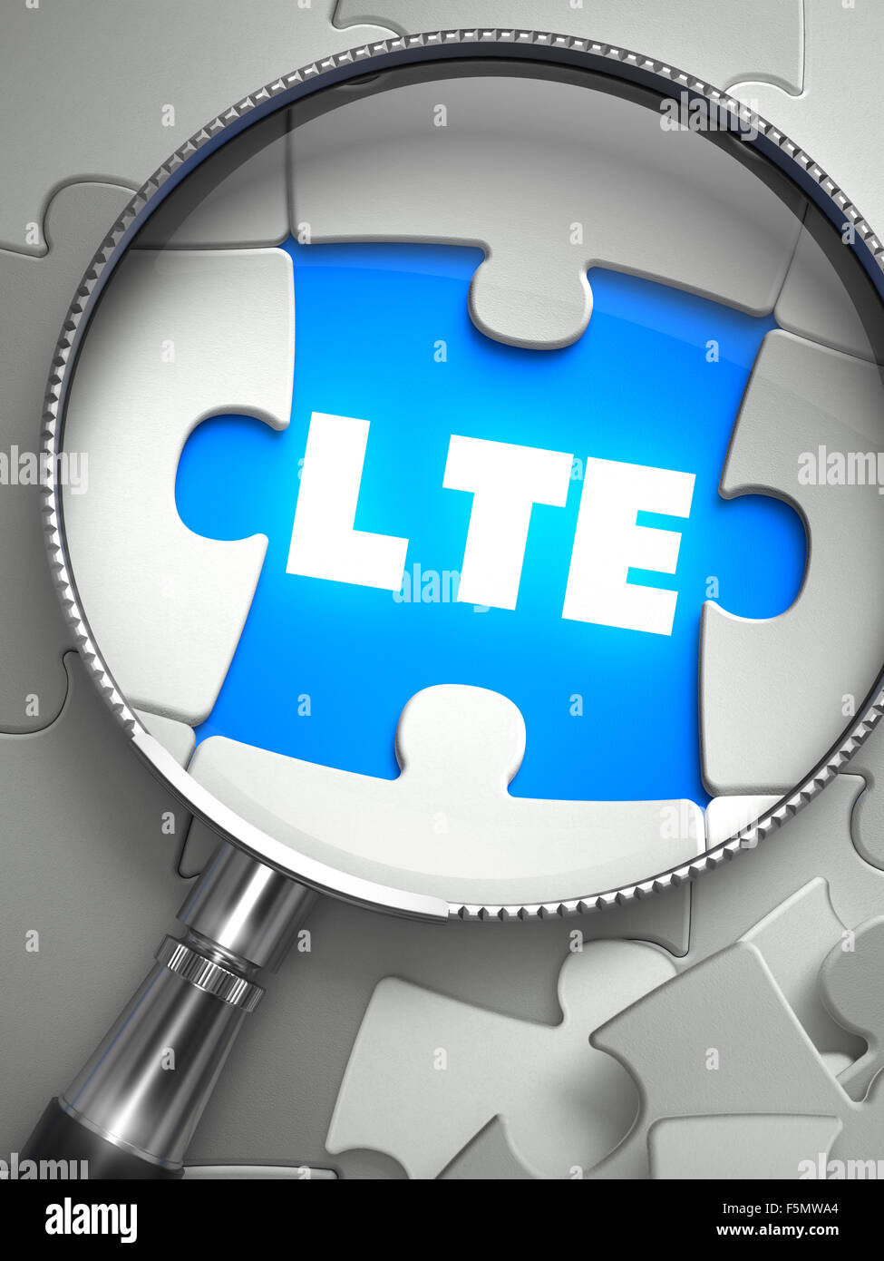 LTE - Long Term Evolution -on the Place of Missing Puzzle Piece through Magnifier. Selective Focus. Stock Photo
