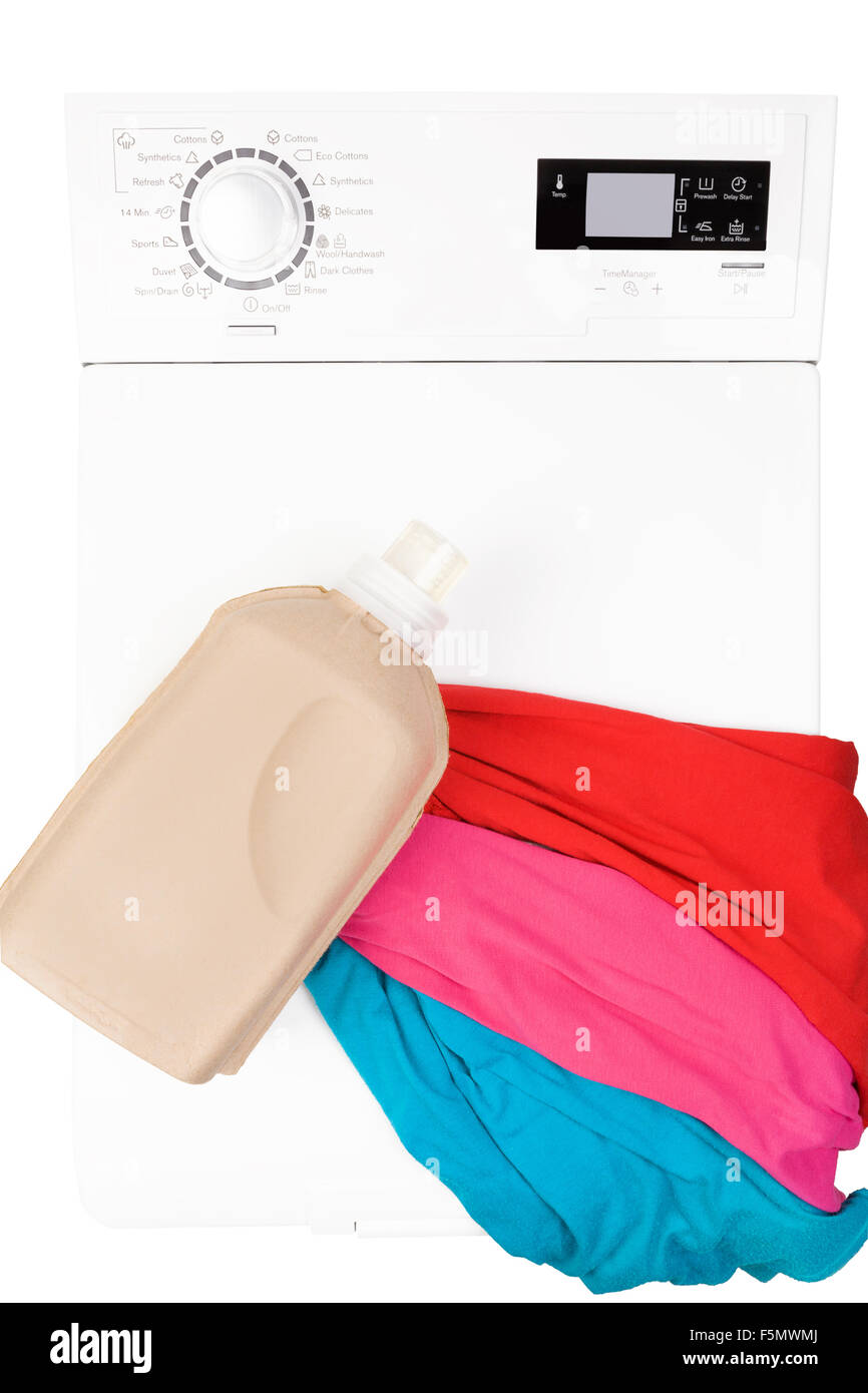 Laundry background. Top loading washing machine with natural organic detergent and colorful clothing isolated on white Stock Photo