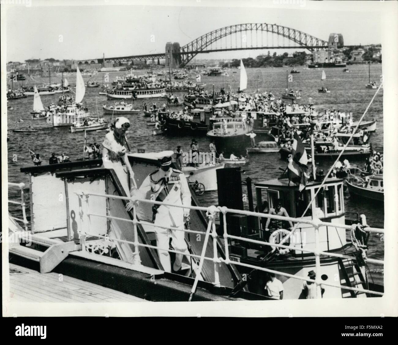 1972 - Queen And The Duke Of Edinburgh Arrive In Australia Boats In The Harbour: A million Australians gathered in Sydney, Australia- today to greet H.M. The Queen and the Duke Of Edinburgh when they arrived aboard the liner Gothic from New Zealand. They were met on the quayside by Field Marsgal Sir William Slim the Governor General of Australia. Photo shows The Queen precedes the Duke Of Edinburgh who were uniform of Admiral of the Fleet - as they step down the gangway of the liner Gothic on arrival in Sydney Harbour. Section of the famous Sydney Harbour Bridge can be seen in the background s Stock Photo