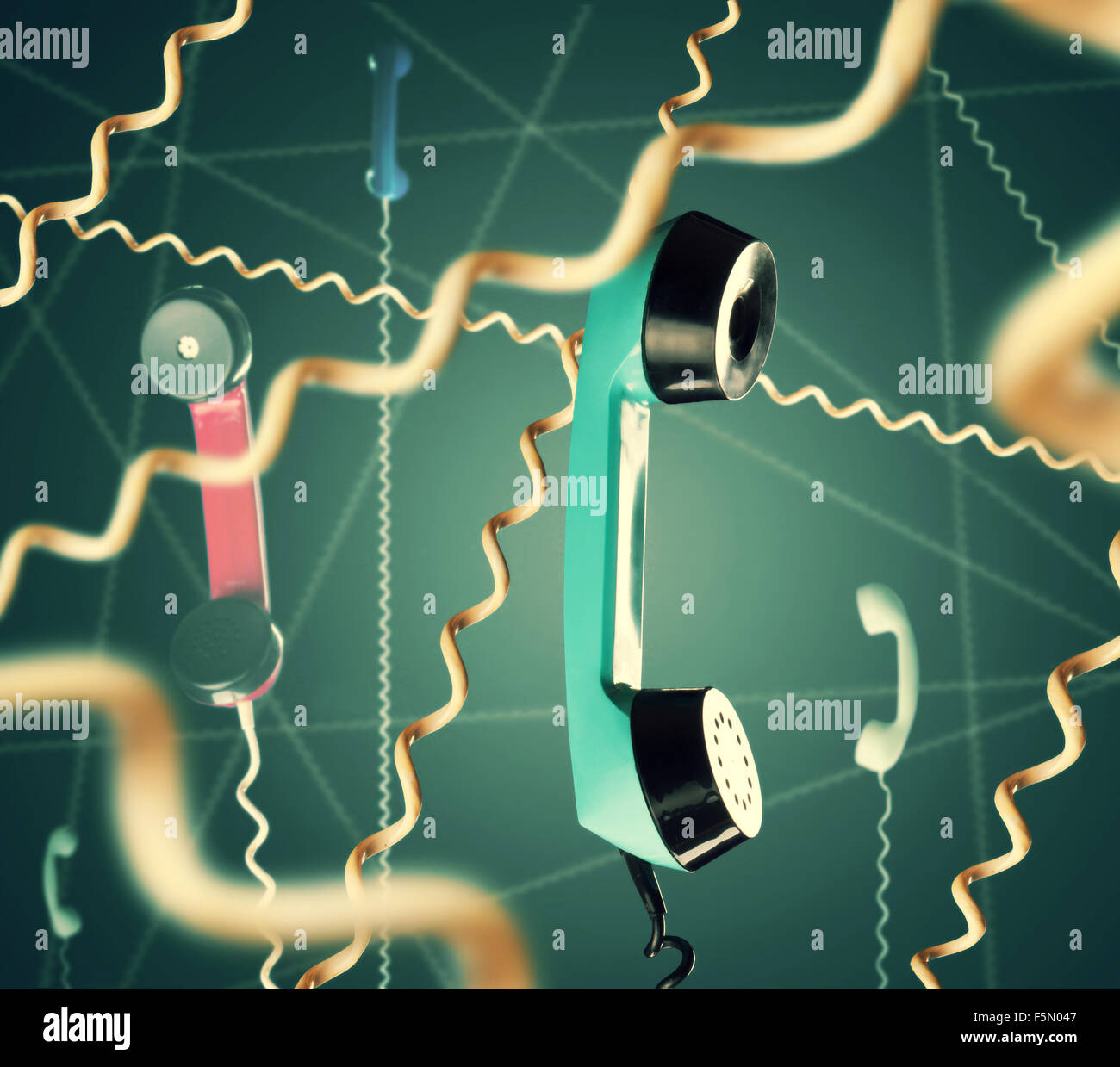 Web of telephone handsets on blue background Stock Photo