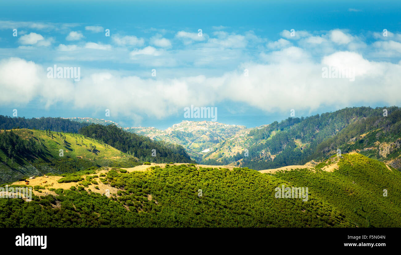 Aerial view of green mountains and towns in the sky landscape Stock ...