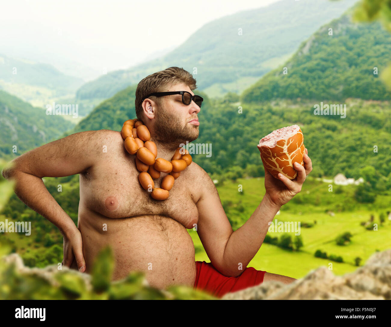 Hunger Neck Hungry man with sausages round his neck eats one more sausage in the ...
