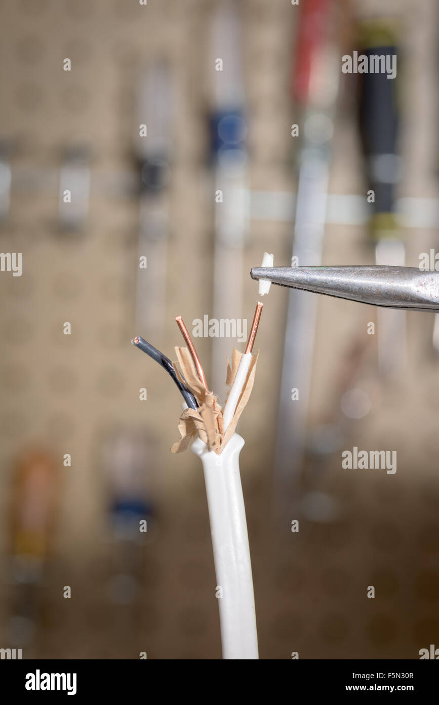Pliers removing insulation from electrical wire Stock Photo Alamy