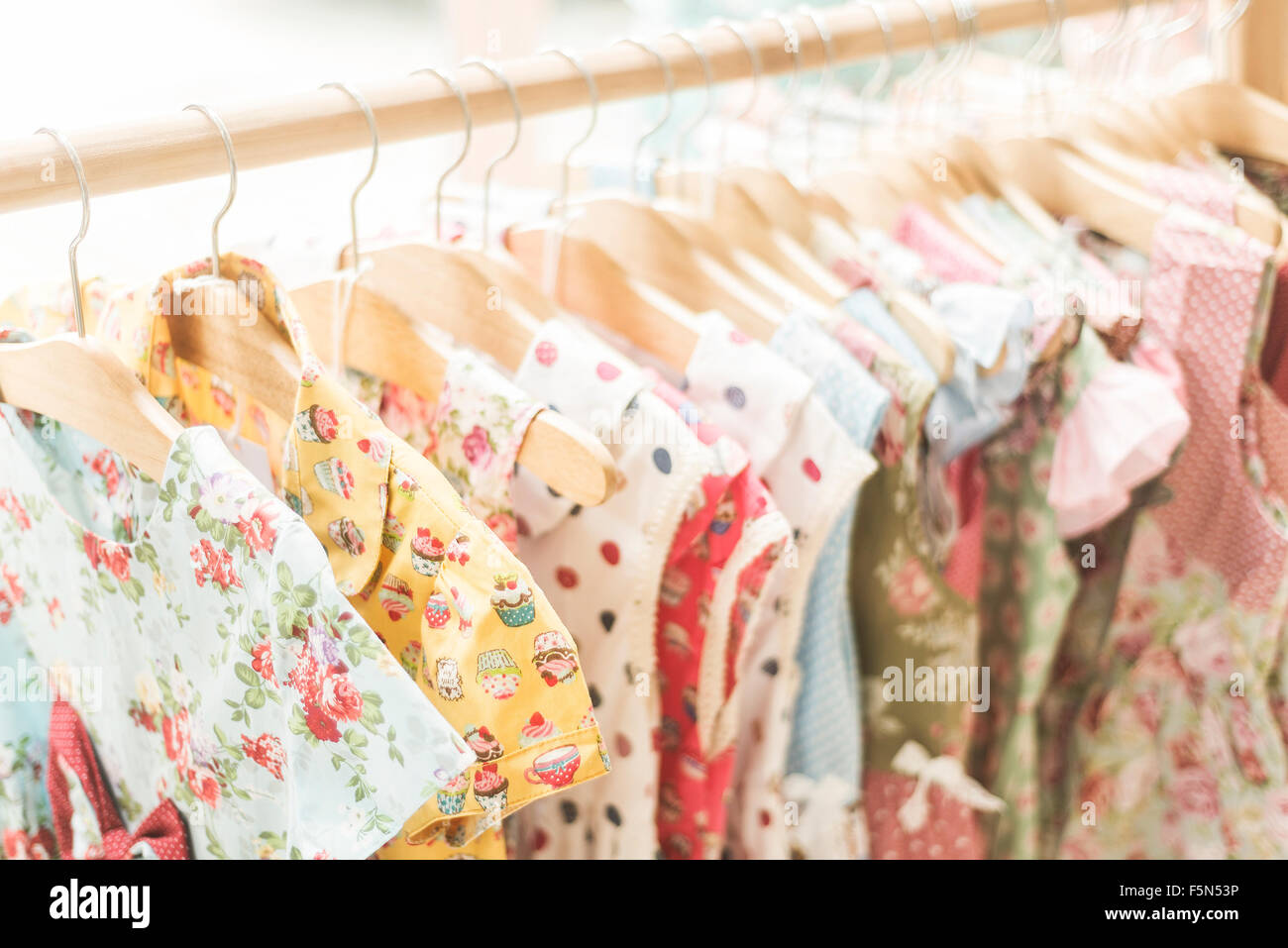 floral pattern young girl dresses in children wear fashion shop Stock Photo