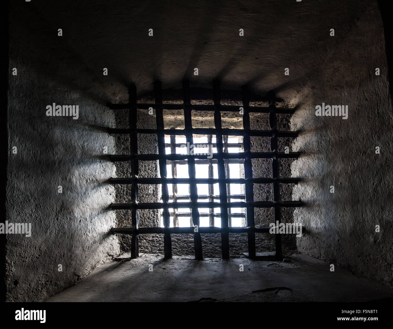 Prison window with steel grating Stock Photo