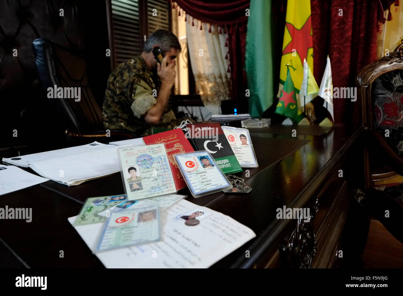 Collection of Turkish identity cards and foreign passports found on the bodies of ISIS or ISIL fighters displayed in the headquarter of the Kurdish People's Protection Units YPG in the city of Qamishli or Qamishlo in Al Hasakah or Hassakeh district in northern Syria Stock Photo