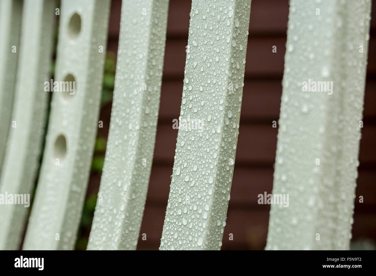 Wooden patio furniture in the rain Stock Photo Alamy