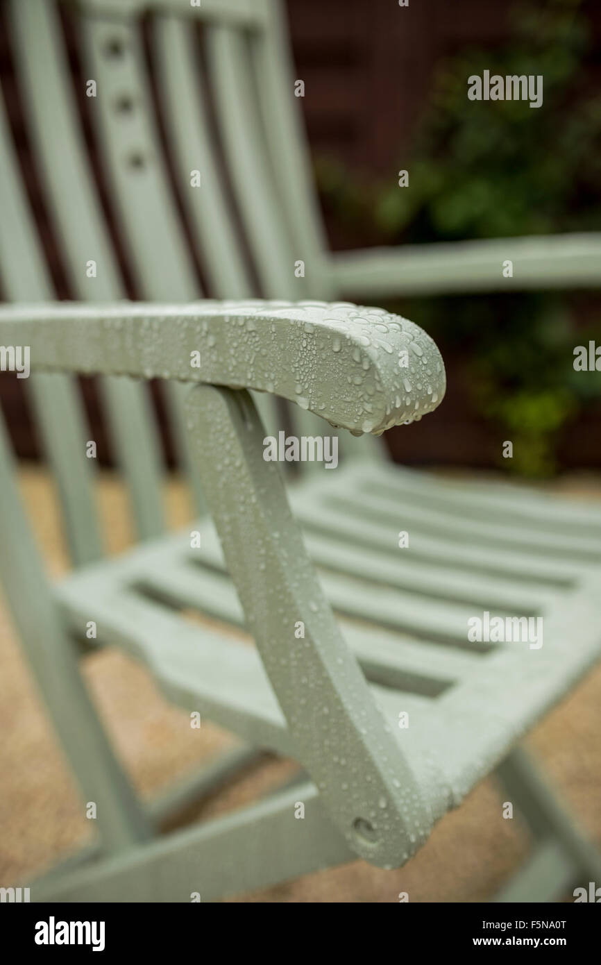 Wooden patio furniture in the rain Stock Photo Alamy