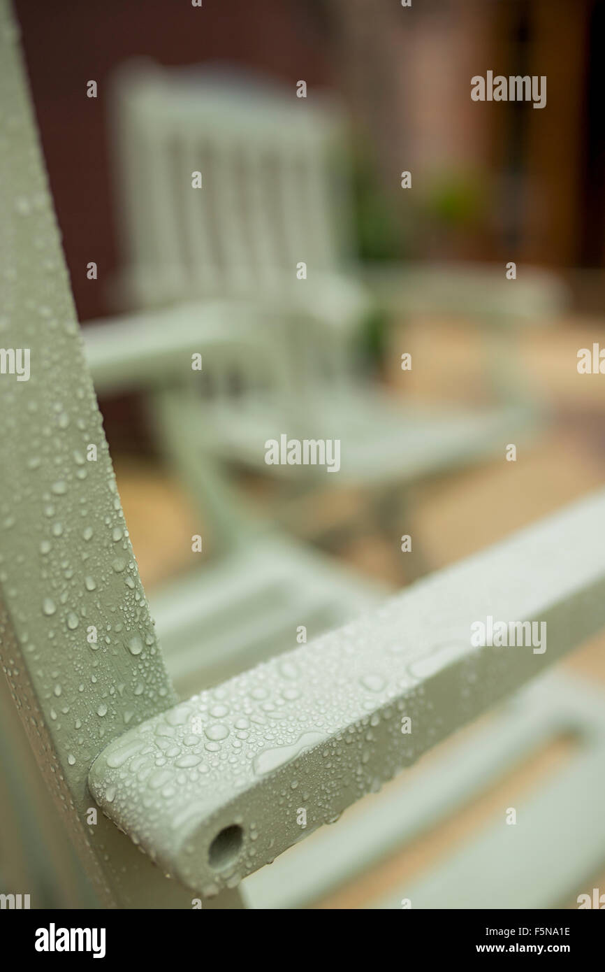 Wooden patio furniture in the rain Stock Photo Alamy