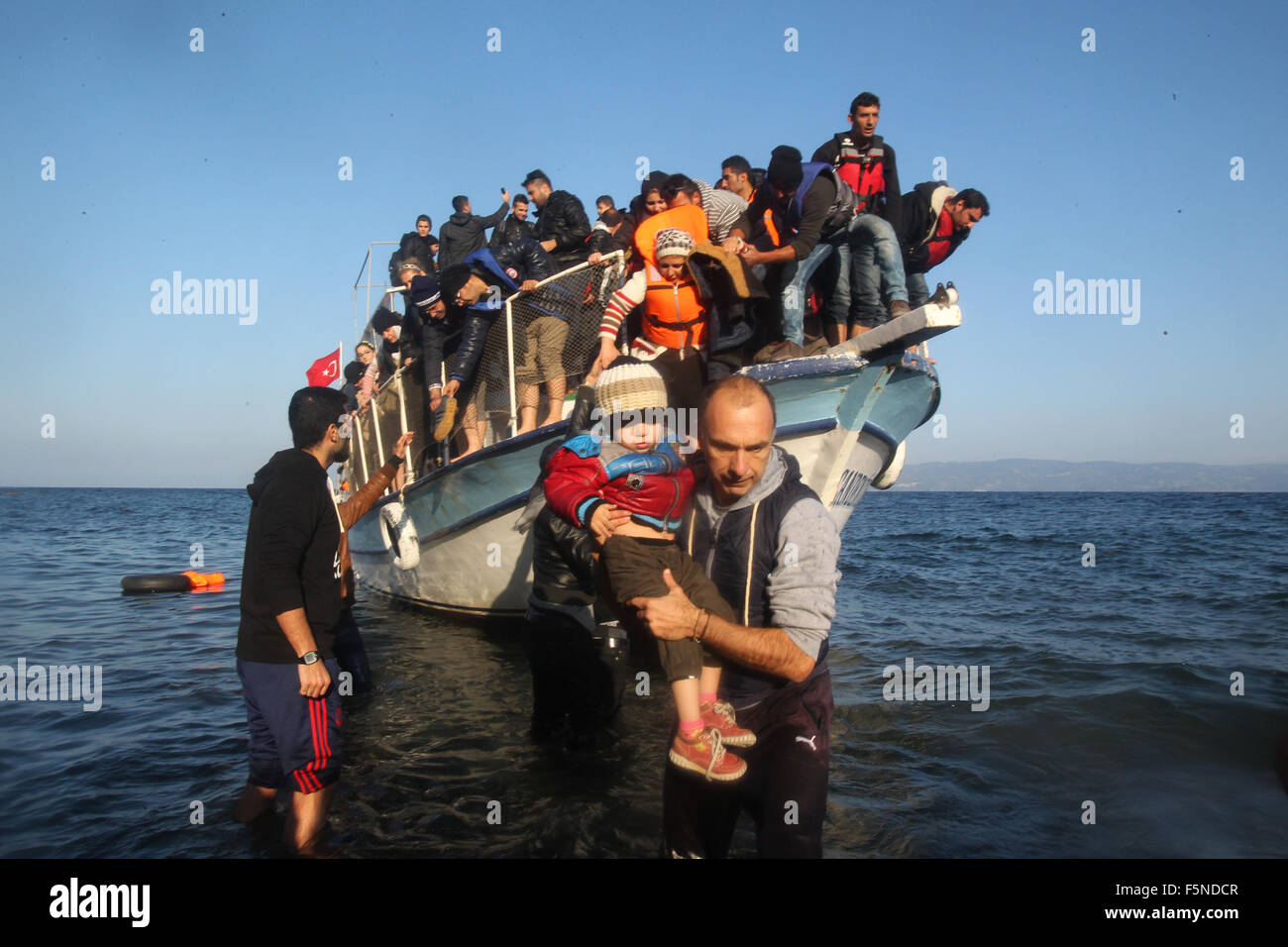 Lesbos, Greece. 07th Nov, 2015. Syrian and Afghan refugees land at Lesbos island, close to Eftalou, after crossing the Aegean Sea, Greece, Nov. 7, 2015. Credit:  Xinhua/Alamy Live News Stock Photo