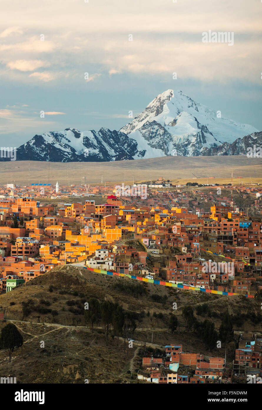 The peak of Huayna Potosi from El Alto above, La Paz, Bolivia. La Paz and El Alto are critically short of water and will probably be the first capital city in the world that will have to be largely abandoned due to lack of water. It relies heavily on glacial meltwater from the surrounding Andean peaks, but as climate change causes the glaciers to melt, it is rapidly running short of water. Stock Photo