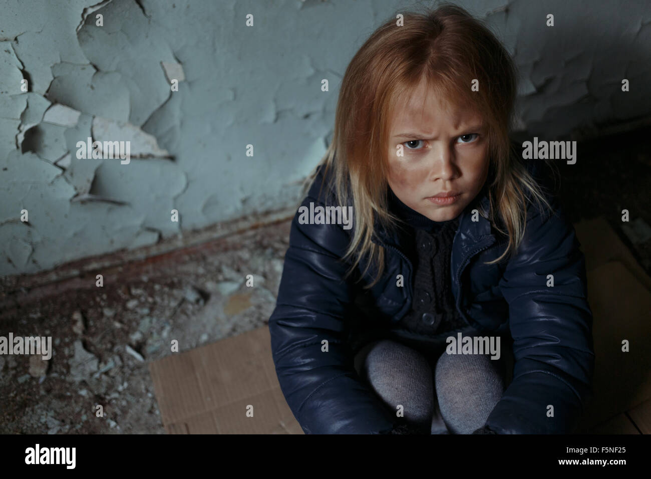 Hopeless girl sitting on the floor Stock Photo - Alamy