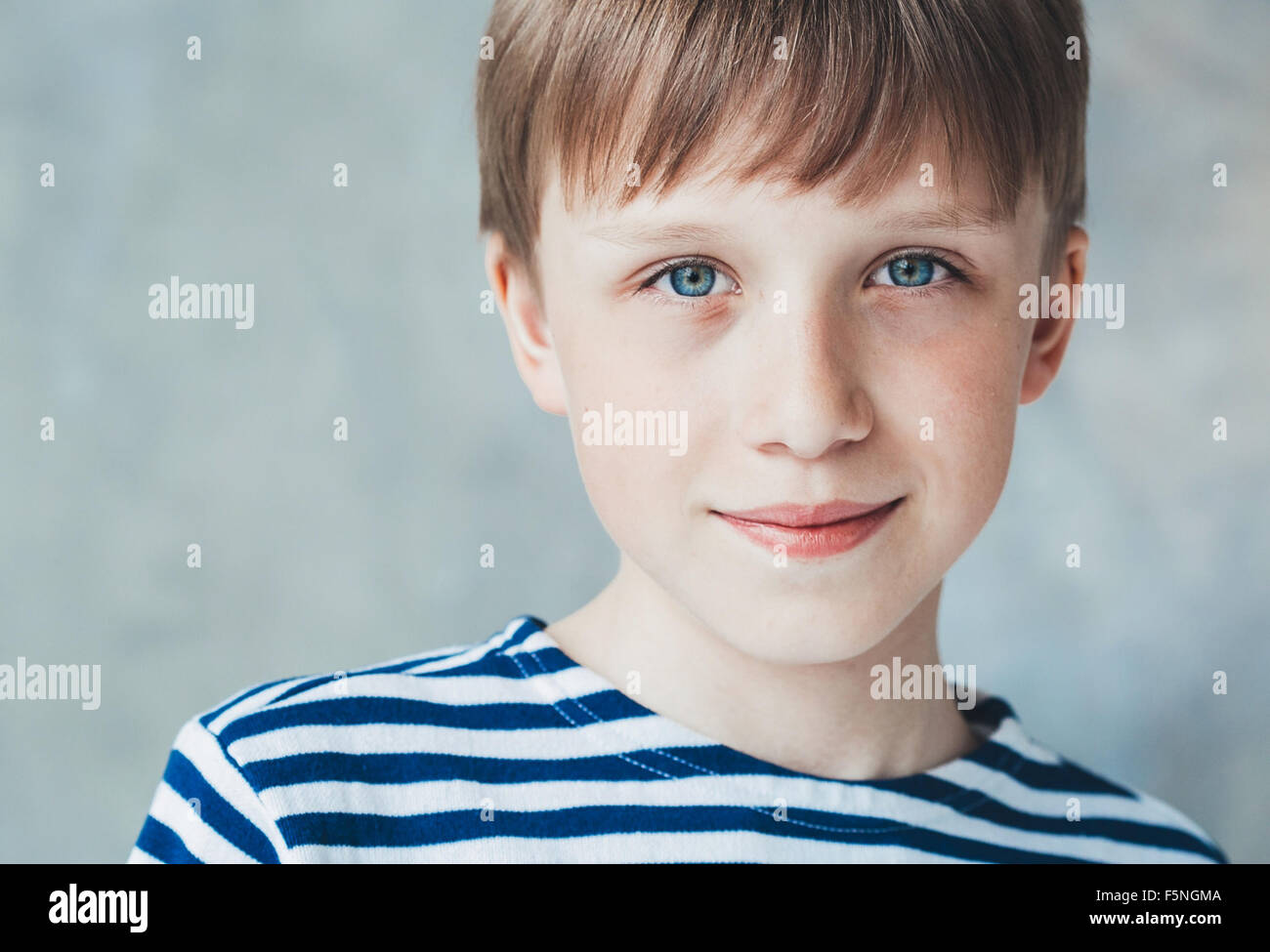Cute boy happy beautiful child studio closeup portrait stripes sitting