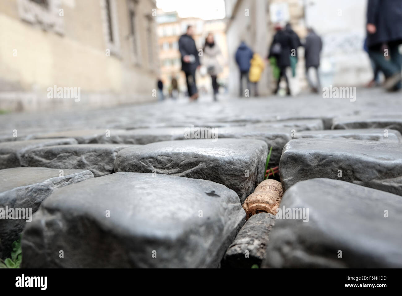 wine corks stuck in pavement in Trastevere, Rome Stock Photo Alamy