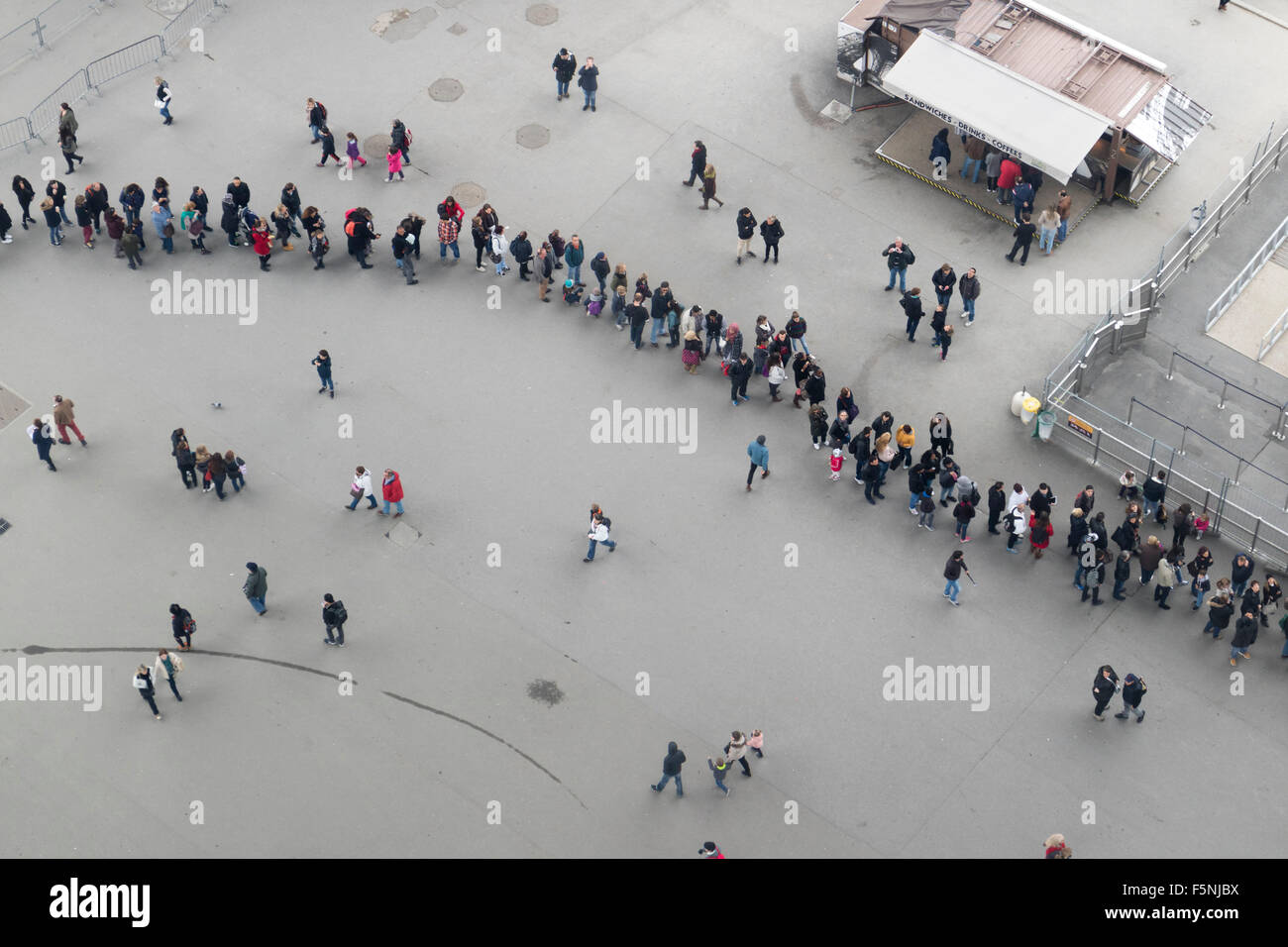Rows of visitors seen from the Eiffel tower from the glass floor on the