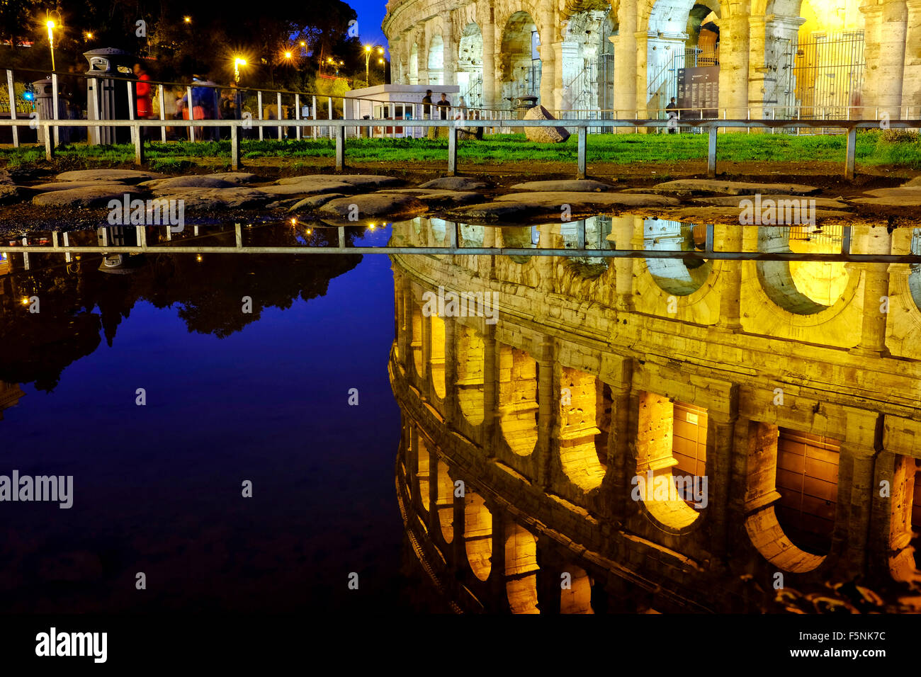 Reflection of the colosseum in the water of a puddle, Rome Italy Stock ...