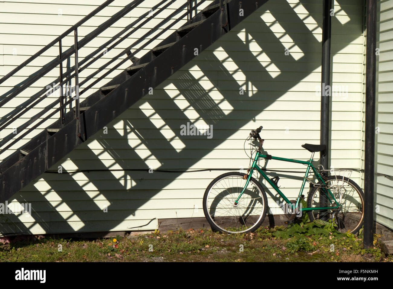 Fire escape and bicycle. Stock Photo