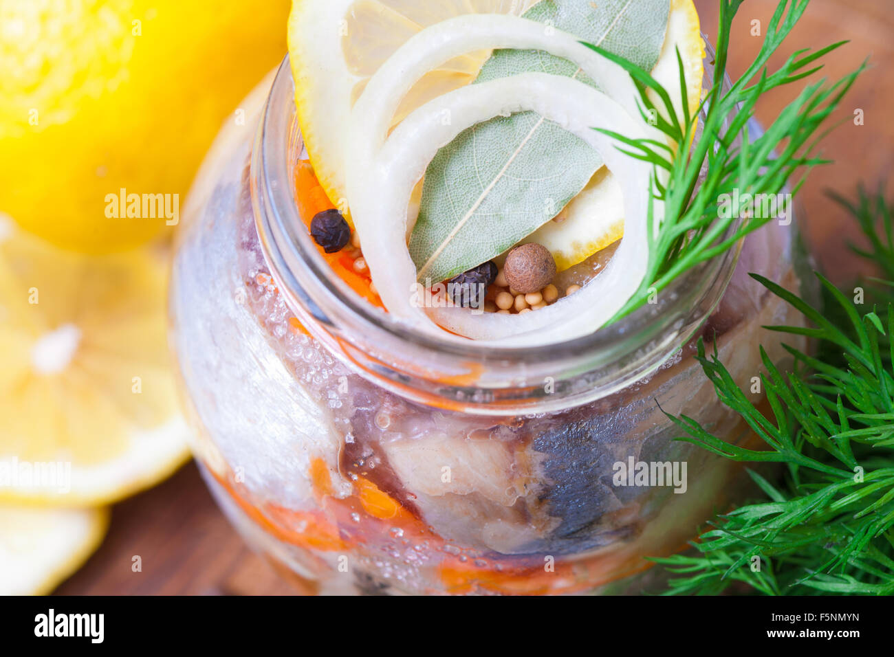 Marinated herring in a jar with vegetables and herbs Stock Photo Alamy