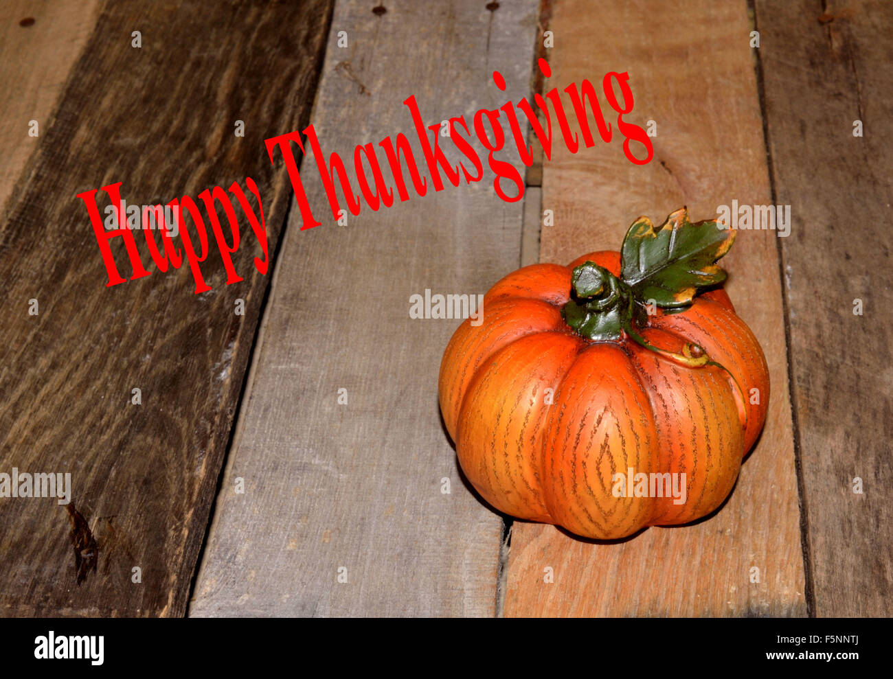 Thanksgiving greeting, pumpkin on pallet wood Stock Photo