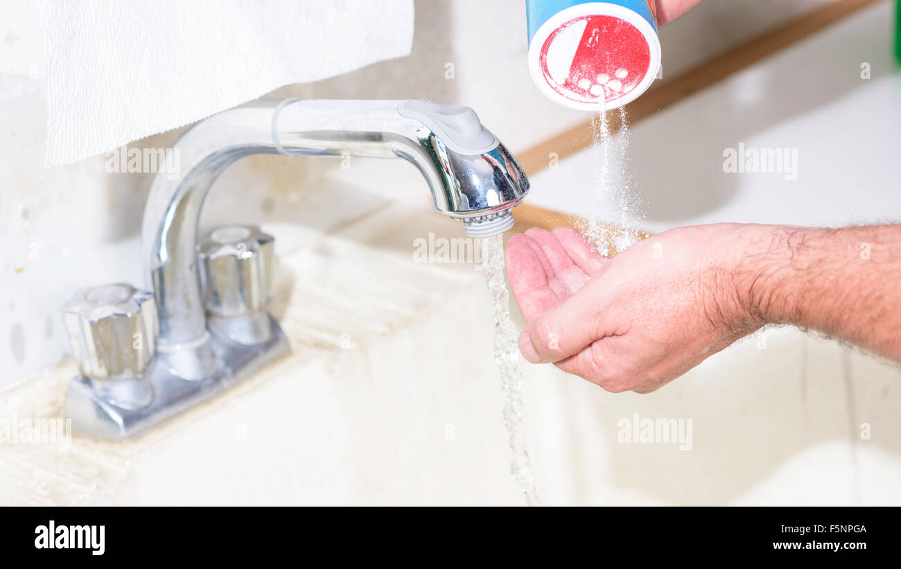 Using powdered soap to wash hands with Stock Photo Alamy