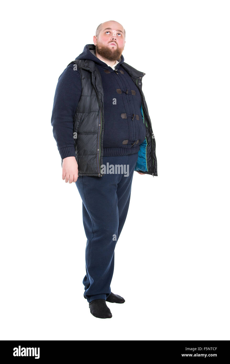 Jolly Fat Man in a Dark Warm Clothes, on white background Stock Photo
