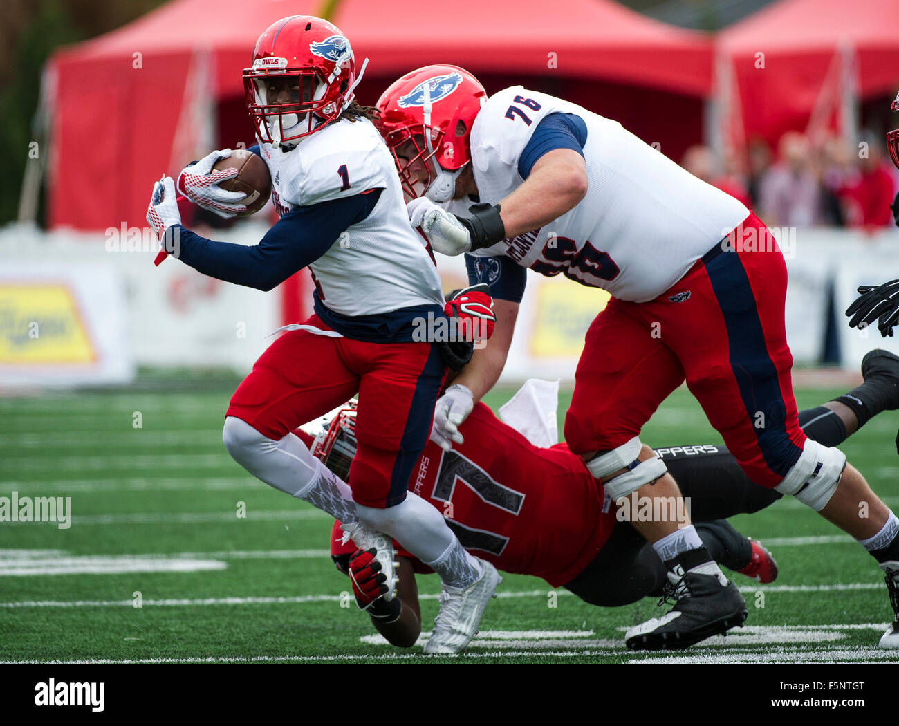 Bowling Green, Kentucky, USA. 7th Nov, 2015. Western Kentucky linebacker Dejon Brown (17) grasps Florida Atlantic wide receiver Henry Bussey (1) by the foot during the first half of an NCAA football game at L.T. Smith Stadium in Bowling Green, Kentucky.Nick Wagner/CSM/Alamy Live News Stock Photo