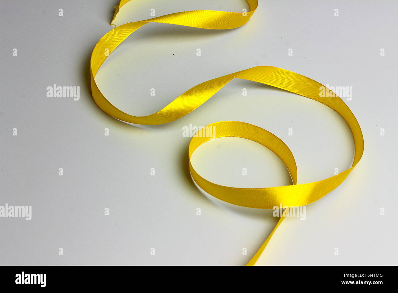 Bright Yellow Ribbons Bright yellow ribbon hi-res stock photography and images - Alamy